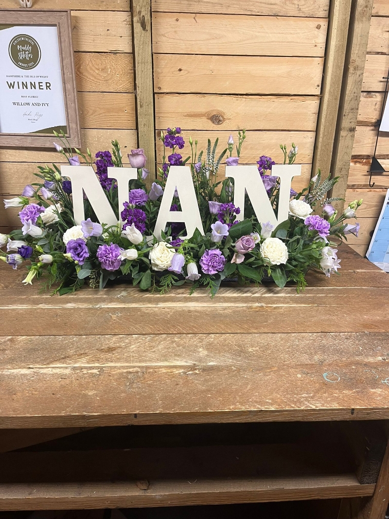 Wooden Letters in a Garden of flowers