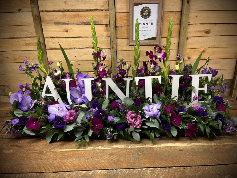 Wooden Letters in a Garden of flowers